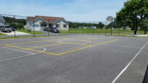 full outdoor basketball court with added pickleball lines