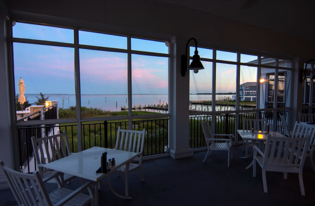 marina club dining tables with bay view through large windows