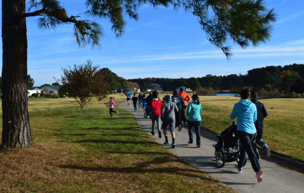 group of runners racing on walking trail